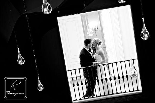 Bride and groom kiss at night during their wedding at the National Museum of Women in Arts in DC